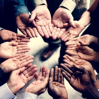 group-of-diverse-hands-in-a-circle-PWF9NP6